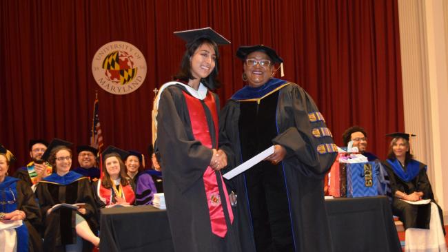 Undergraduate student receiving diploma